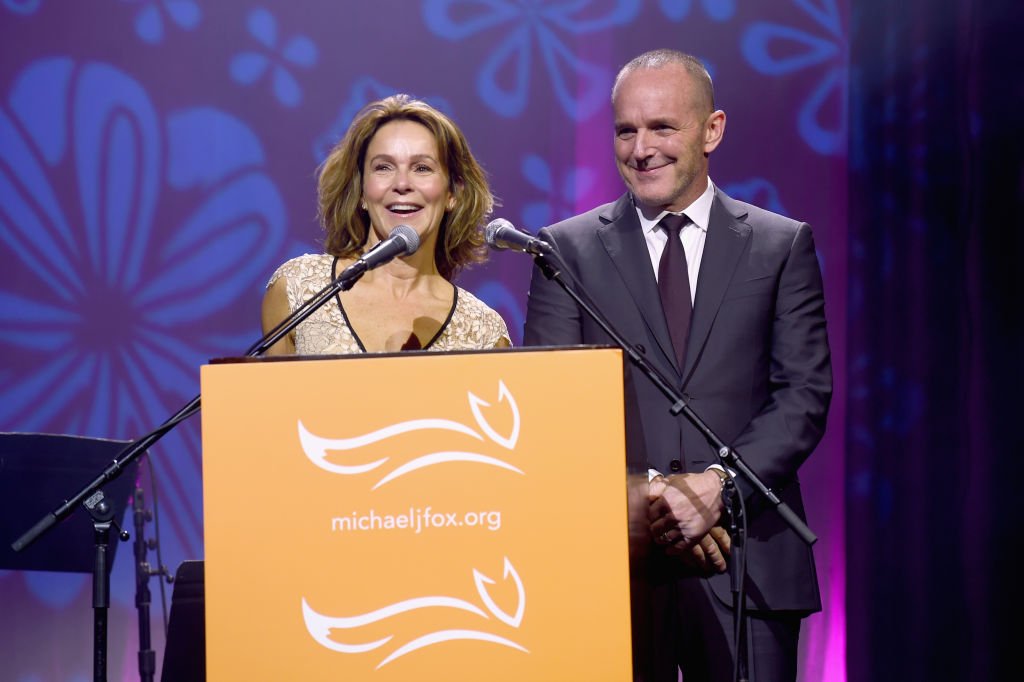 Image Credits: Getty Images / Jamie McCarthy | Jennifer Grey and Clark Gregg speak on stage at A Funny Thing Happened On The Way To Cure Parkinson's benefitting The Michael J. Fox Foundation at the Hilton New York on November 10, 2018.