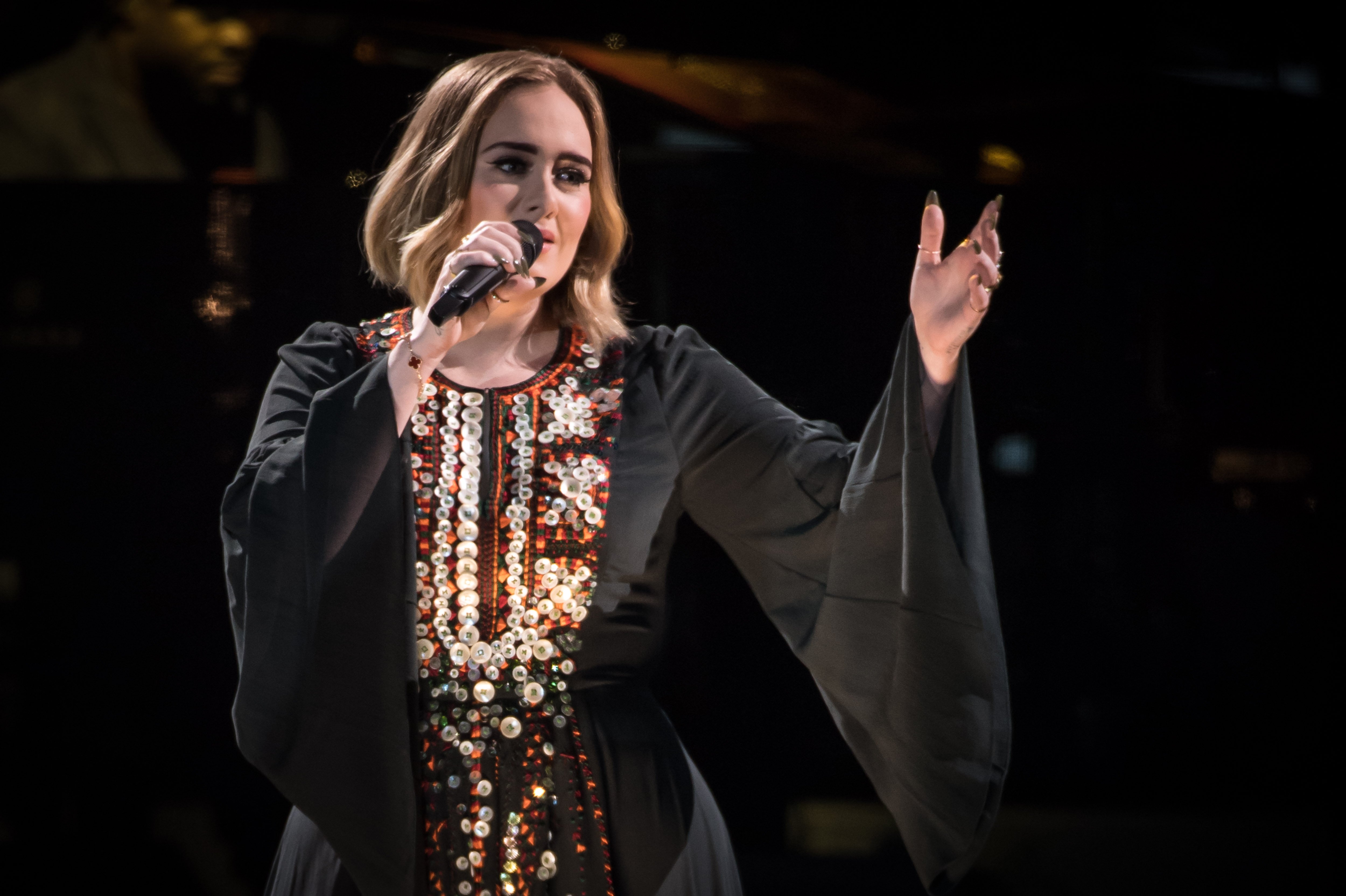 Image Credit: Getty Images / Adele performing at a concert. Image Credit: Getty Images / Adele performing at a concert.