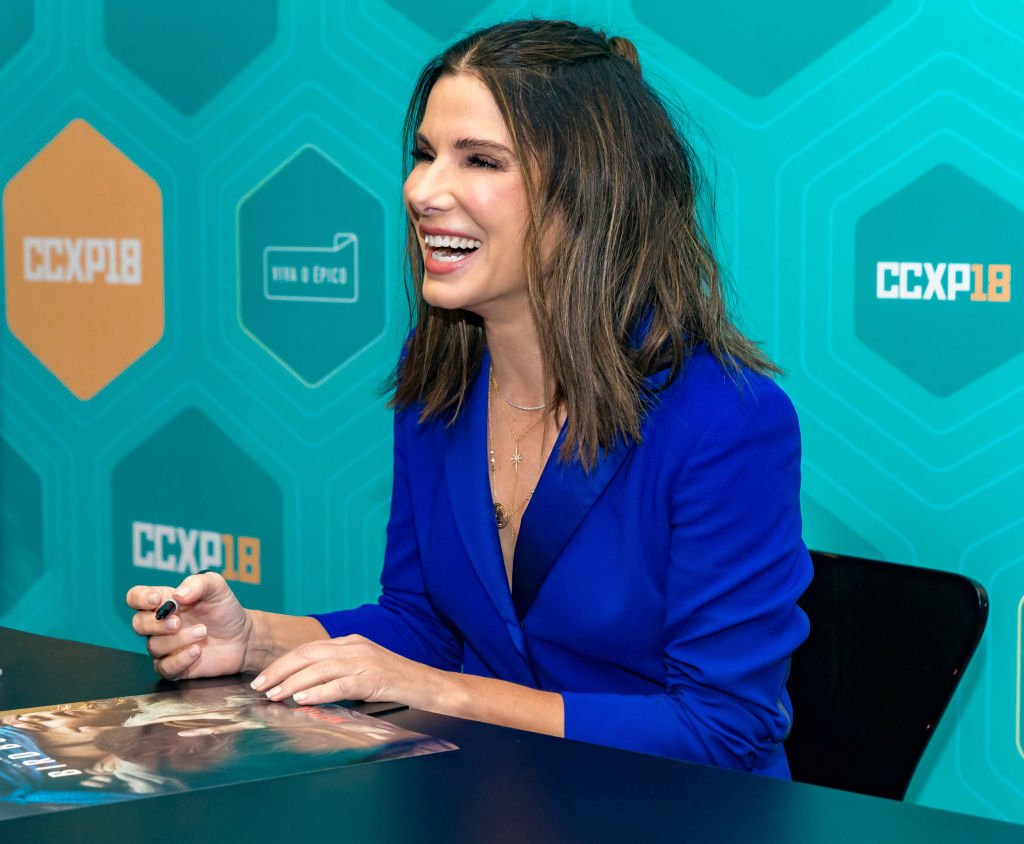 Image Credits: Getty Images / Alexandre Schneider | Sandra Bullock signs autographs at Comic-Con São Paulo on December 9, 2018 in Sao Paulo, Brazil.