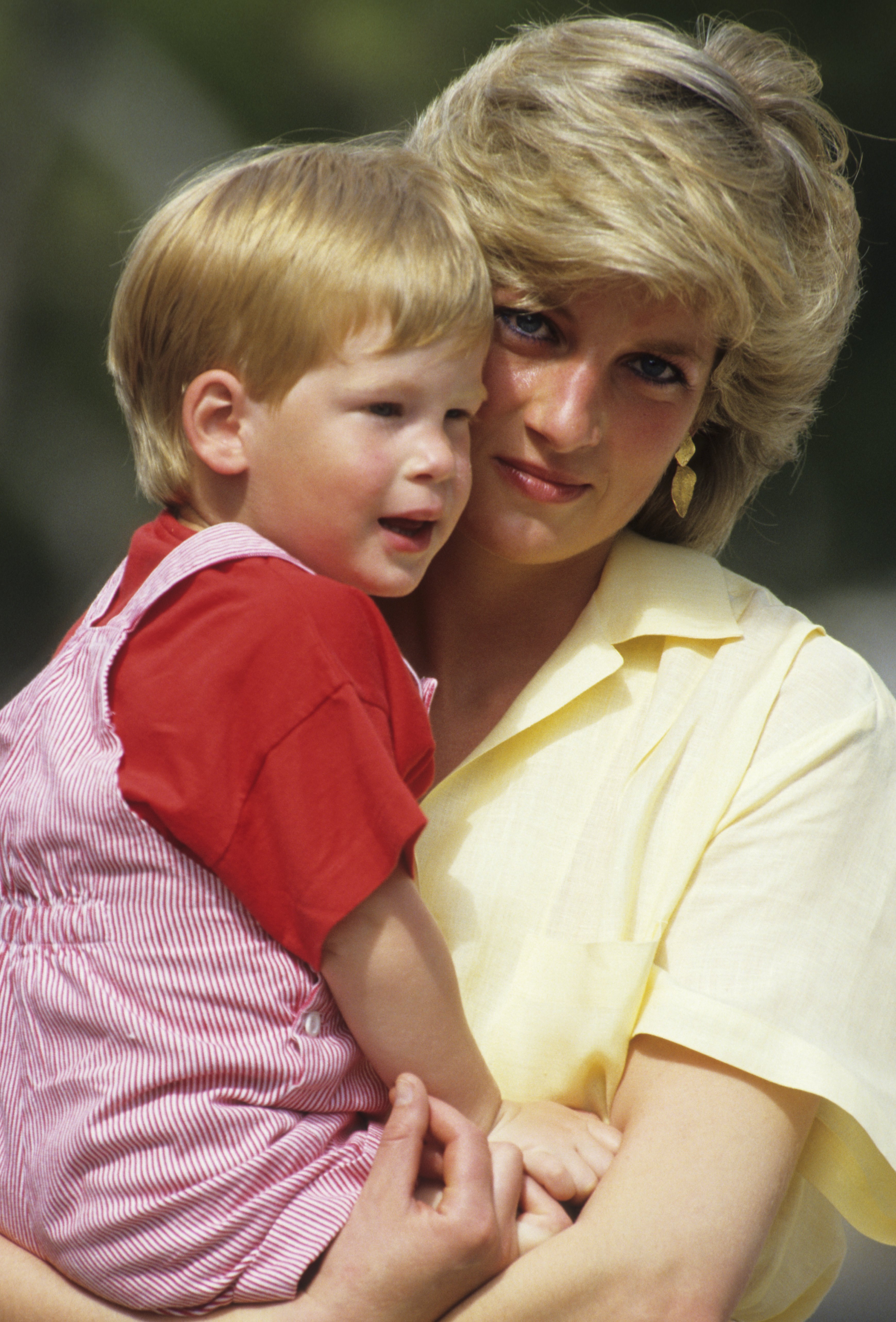 Image Credits: Getty Images / Georges De Keerle | Diana, Princess of Wales with Prince Harry on holiday in Mallorca, Spain on August 10, 1987.