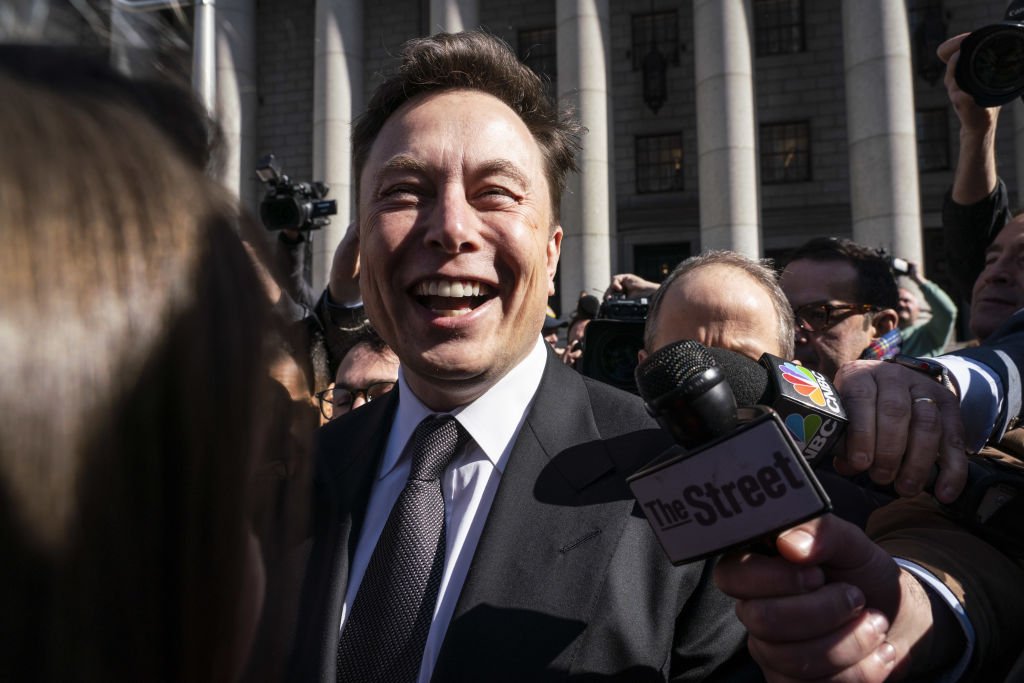 Elon Musk, chief executive officer of Tesla Inc., smiles while speaking to members of the media in New York, U.S., on Thursday, April 4, 2019.