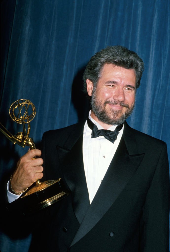 Image Credits: Getty Images / Kevin Winter/DMI/The LIFE Picture Collection | John Larroquette holding his 4th Emmy