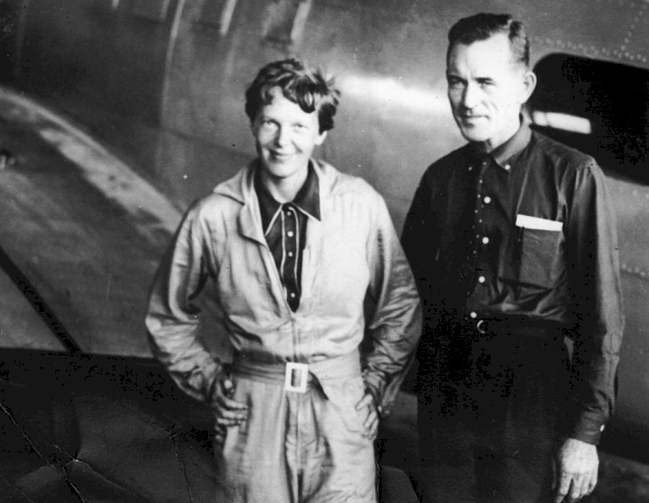 Image Credit: Getty Images / American aviatrix Amelia Earhart (1897 - 1937) with her navigator, Captain Fred Noonan, in the hangar.