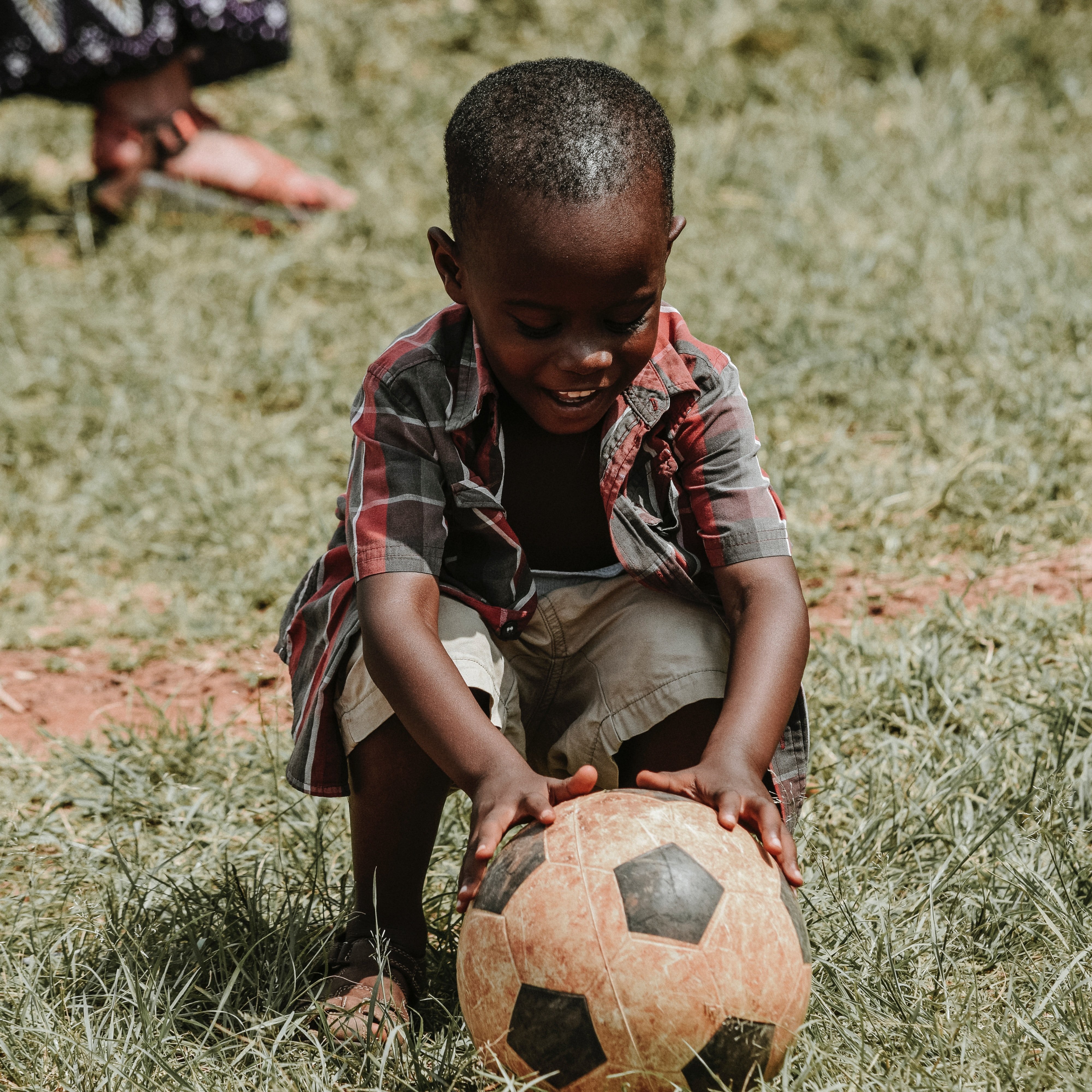 Child playing in garden | Photo by Seth Doyle on Unsplash