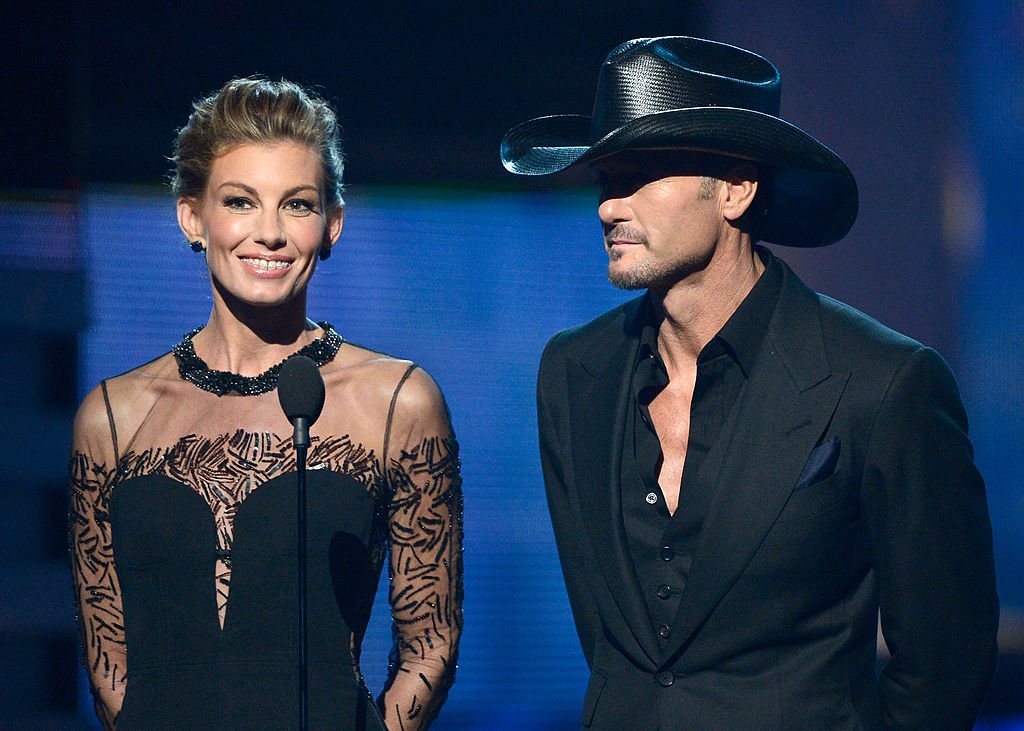 Image Credits: Getty Images / Kevork Djansezian | Singers Faith Hill and Tim McGraw speak onstage at the 55th Annual GRAMMY Awards at Staples Center on February 10, 2013 in Los Angeles, California. Image Credits: Getty Images / Kevork Djansezian | Singers Faith Hill and Tim McGraw speak onstage at the 55th Annual GRAMMY Awards at Staples Center on February 10, 2013 in Los Angeles, California.