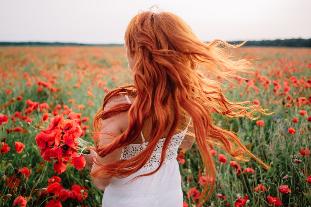 Red haired woman | Shutterstock