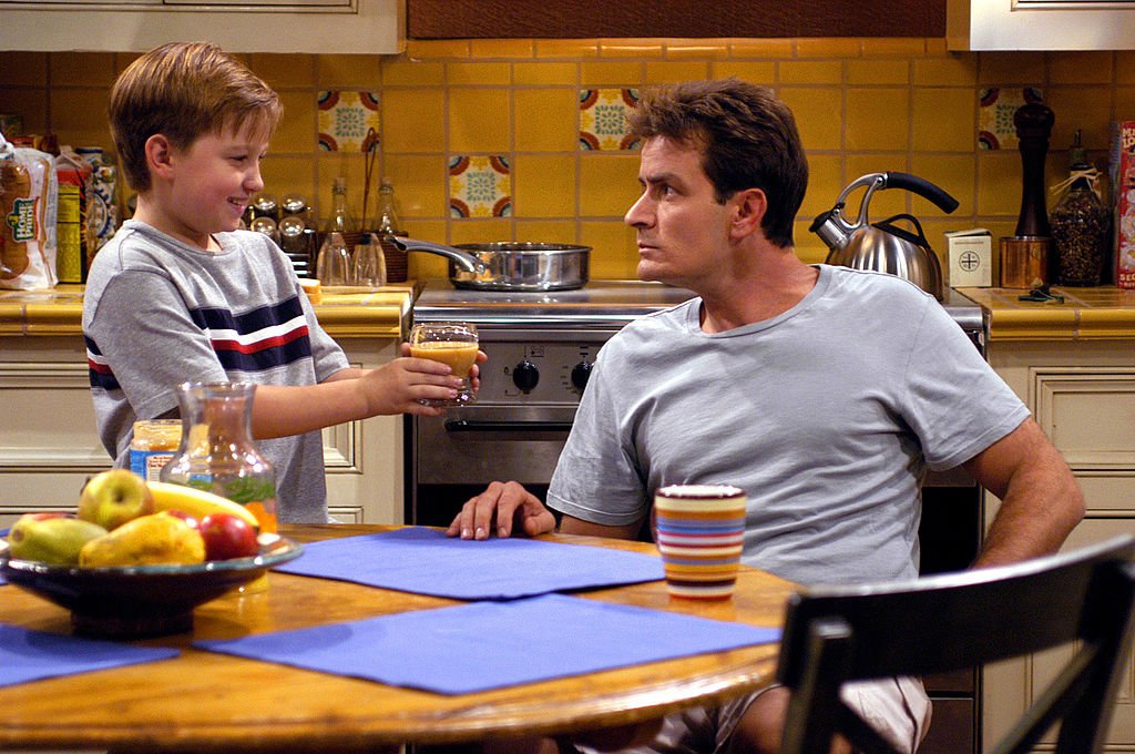 Image Credit: Getty Images / Actors Charlie Sheen and August T. Jones on set for the series Two and A Half Men.