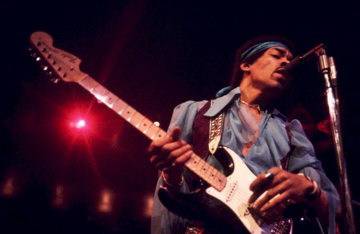 Image Credit: Getty Images / Jimi Hendrix performing at a show.