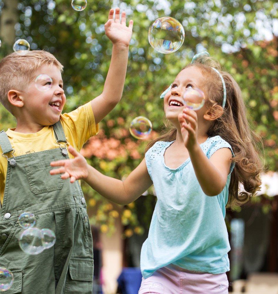 Children playing at a playground | Shutterstock