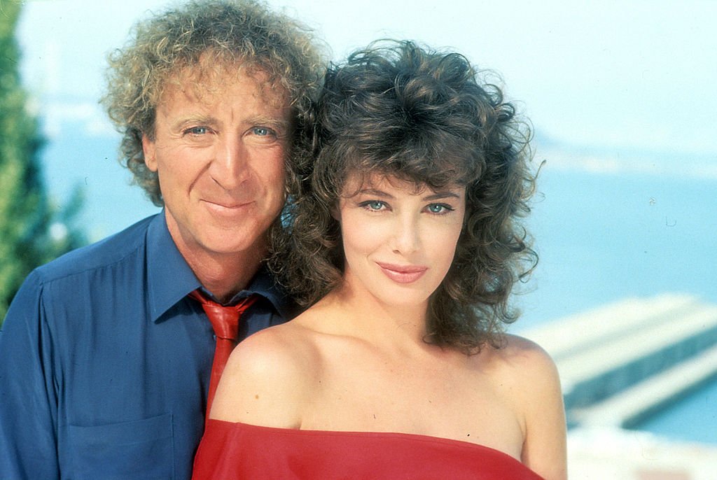 Image Credits: Getty Images / Orion | Gene Wilder and Kelly LeBrock in publicity portrait for the film 'The Woman In Red', 1984. Image Credits: Getty Images / Orion | Gene Wilder and Kelly LeBrock in publicity portrait for the film 'The Woman In Red', 1984.