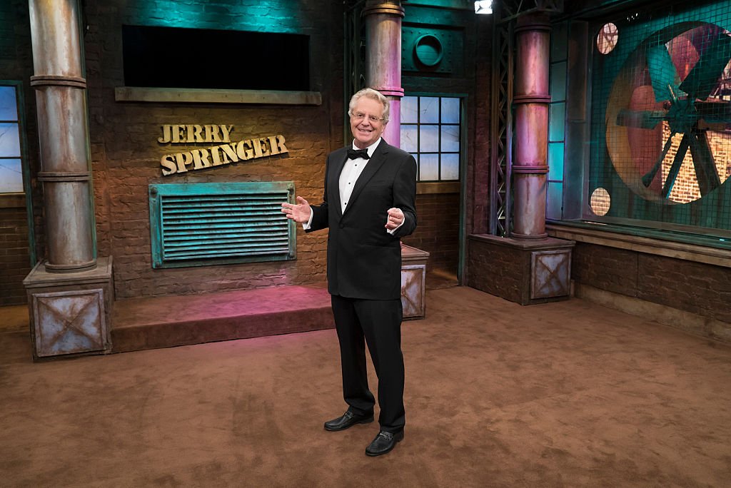 Image Source: Getty Images/NBCU Photo Bank/NBCUniversal via Getty Images/Virginia Sherwood | Jerry Springer on set
