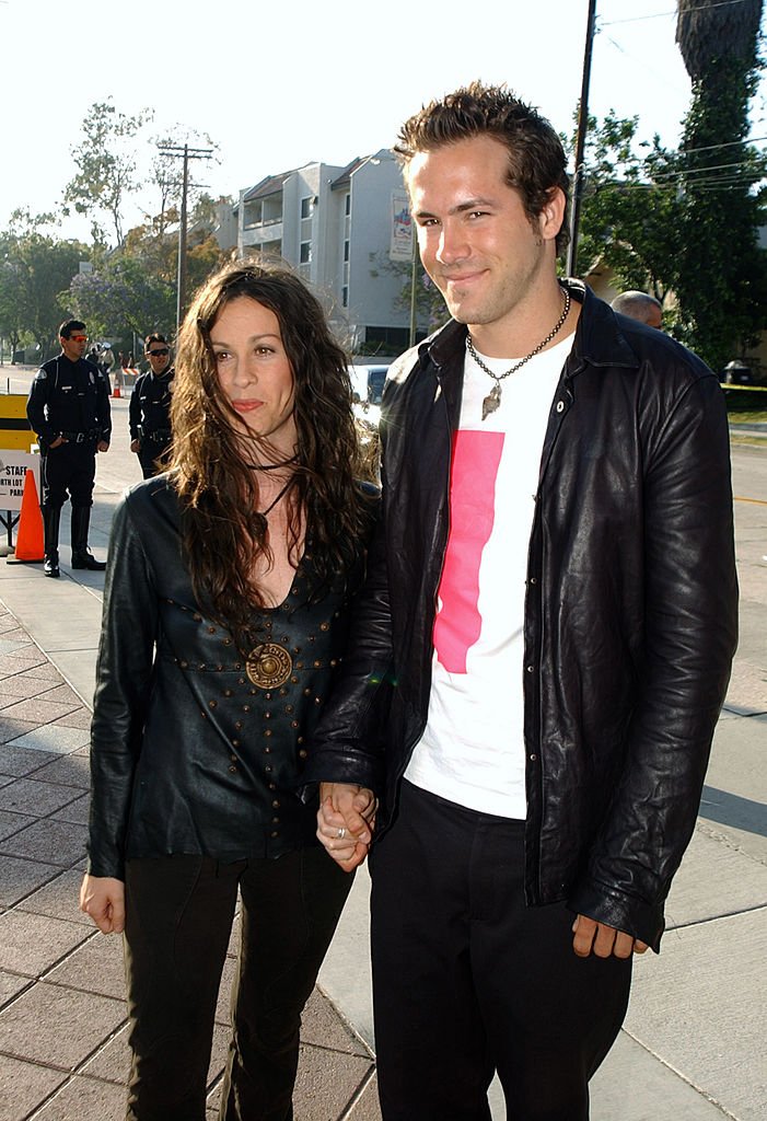 Image Source: Getty Images/Jeff Kravitz | Alanis Morissette and Ryan Reynolds during 2003 MTV Movie Awards