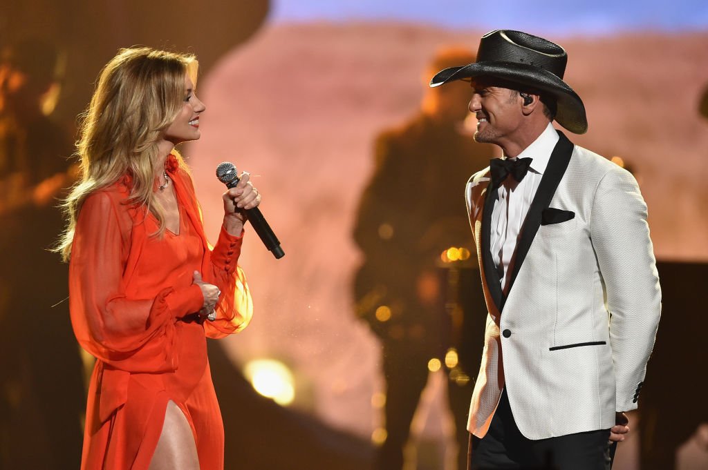 Image Credits: Getty Images / John Shearer / WireImage | Faith Hill and Tim McGraw perform onstage at the 51st annual CMA Awards at the Bridgestone Arena on November 8, 2017 in Nashville, Tennessee. Image Credits: Getty Images / John Shearer / WireImage | Faith Hill and Tim McGraw perform onstage at the 51st annual CMA Awards at the Bridgestone Arena on November 8, 2017 in Nashville, Tennessee.