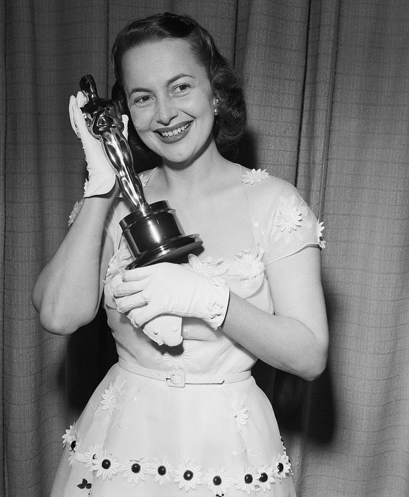 Image Credits: Getty Images / Bettmann | Olivia De Havilland proudly displays her second "Oscar," awarded for her performance as the Best Actress of 1949 Image Credits: Getty Images / Bettmann | Olivia De Havilland proudly displays her second "Oscar," awarded for her performance as the Best Actress of 1949