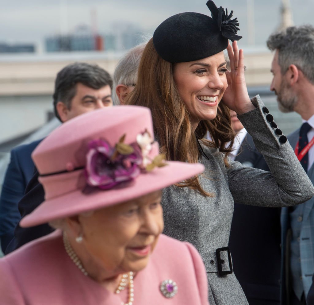 Image Credit: Getty Images / Queen Elizabeth II and Catherine, Duchess of Cambridge visit King's College on March 19, 2019 in London, England.