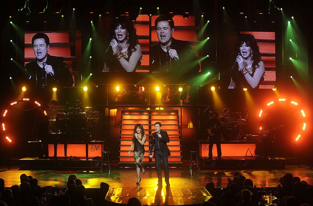 Image Credit: Getty Images / Marie Osmond and Donny Osmond perform at the Donny and Marie Show on December 3, 2008 in Las Vegas, Nevada.