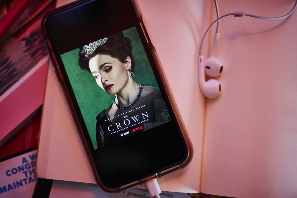 Image Credits: Getty Images / Gabby Jones / Bloomberg | The home screen for the Netflix Inc. original web television series "The Crown" is displayed on an Apple Inc. iPhone in an arranged photograph taken in the Brooklyn Borough of New York, U.S., on Thursday, Jan. 2, 2020.