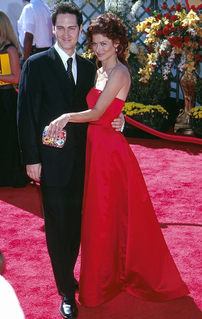 Image Source: Getty Images/Scott Gries| Debra Messing ('Will and Grace') in Vera Wang with her husband Daniel Zelman at the 2000 Emmy Awards on September 10, 2000 held in Los Angeles, CA