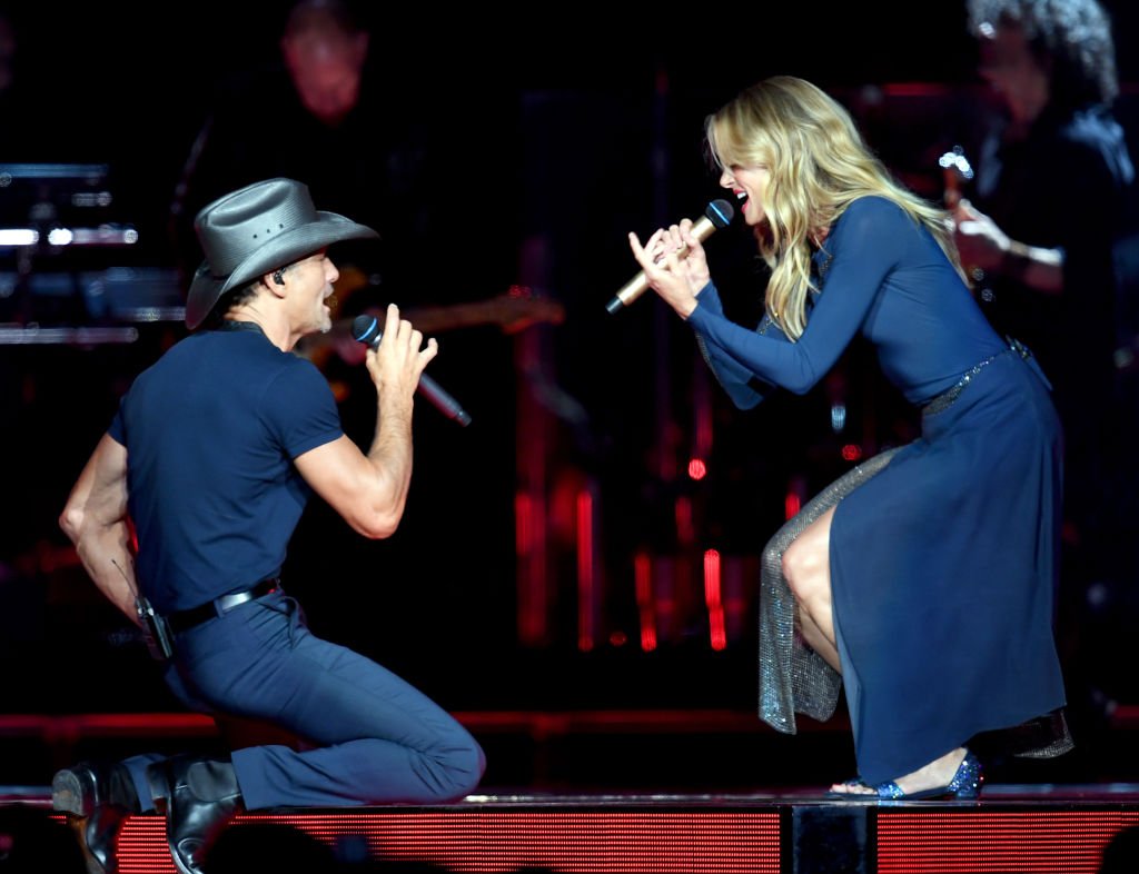 Image Credits: Getty Images / Kevin Winter | Tim McGraw (L) and Faith Hill perform onstage during the "Soul2Soul" World Tour at Staples Center on July 14, 2017 in Los Angeles, California. Image Credits: Getty Images / Kevin Winter | Tim McGraw (L) and Faith Hill perform onstage during the "Soul2Soul" World Tour at Staples Center on July 14, 2017 in Los Angeles, California.