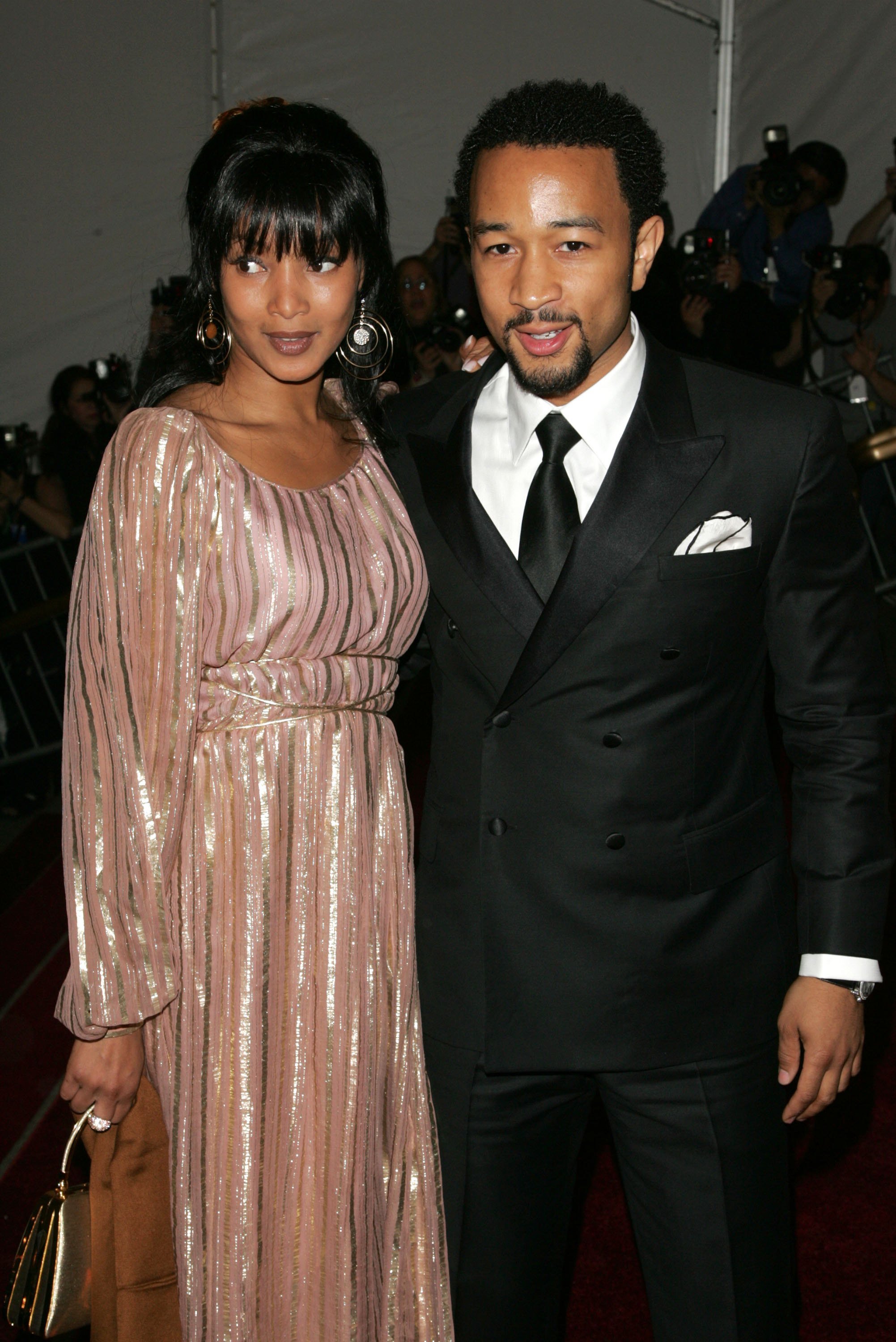 John Legend and an unidentified guest attend the Metropolitan Museum of Art / Getty Images