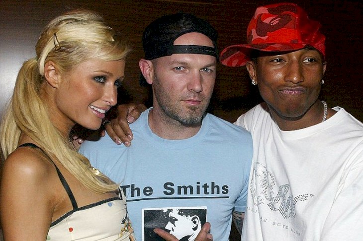 Image Credits: Getty Images / Mark Mainz | Socialite Paris Hilton, musicians Fred Durst and Pharrell Williams attend the launch party for "Reebok's Billionaire Boys Club Apparel line and Ice Cream Footwear Collection" at Astra West on August 11, 2004 in Los Angeles, California.