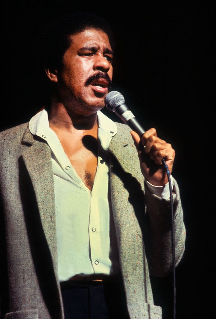 Image Credits: Getty Images / Paul Natkin | Richard Pryor performing on stage
