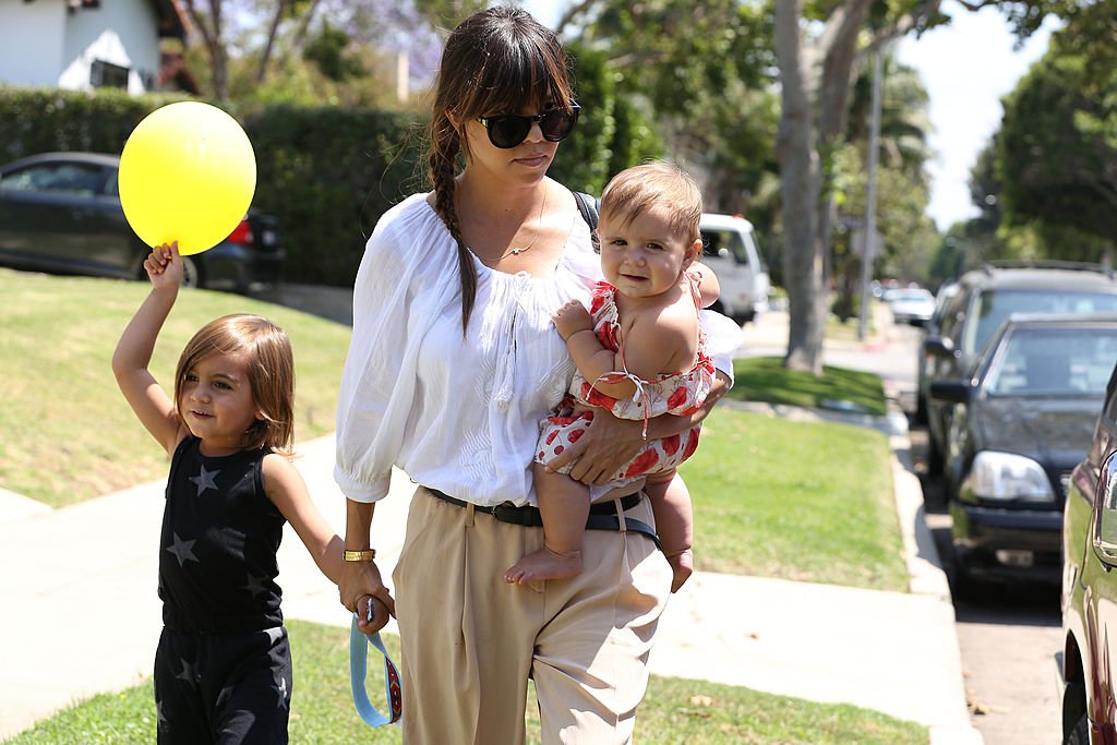 Image Credits: Getty Images / Bauer-Griffin / GC Images | Kourtney Kardashian with children Mason Disick and Penelope Disick are seen on June 08, 2013 in Los Angeles, California.