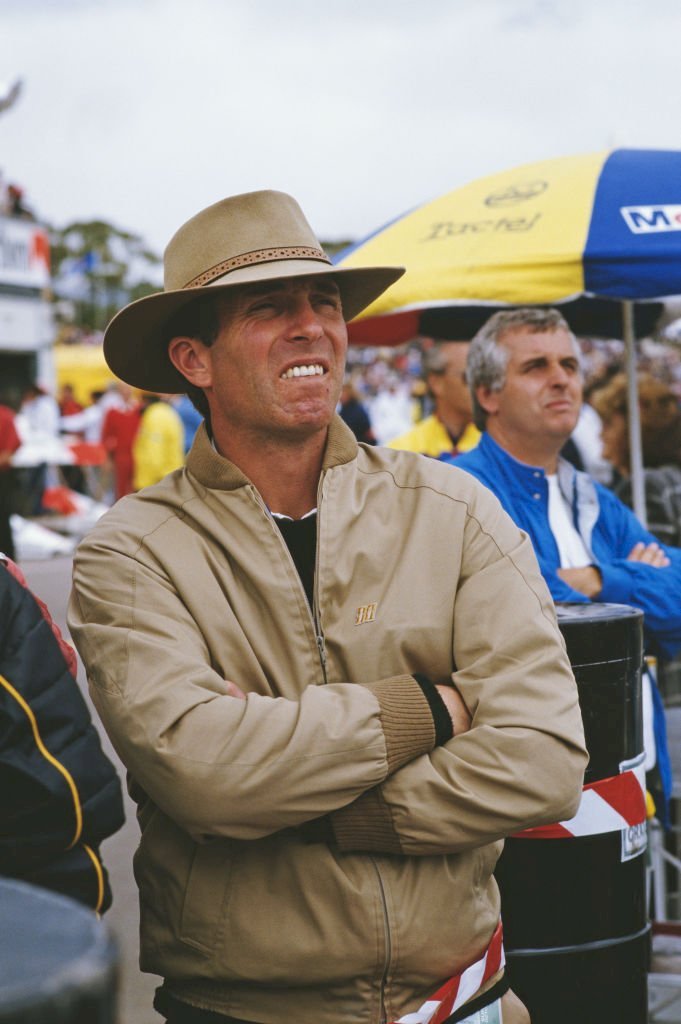 Image Credits: Getty Images / Bryn Colton | Captain Mark Phillips, the husband of Princess Anne, in the pit lane ahead of the 1986 Australian Grand Prix at the Adelaide Street Circuit in Adelaide, Australia, 26th October 1986. Image Credits: Getty Images / Bryn Colton | Captain Mark Phillips, the husband of Princess Anne, in the pit lane ahead of the 1986 Australian Grand Prix at the Adelaide Street Circuit in Adelaide, Australia, 26th October 1986.