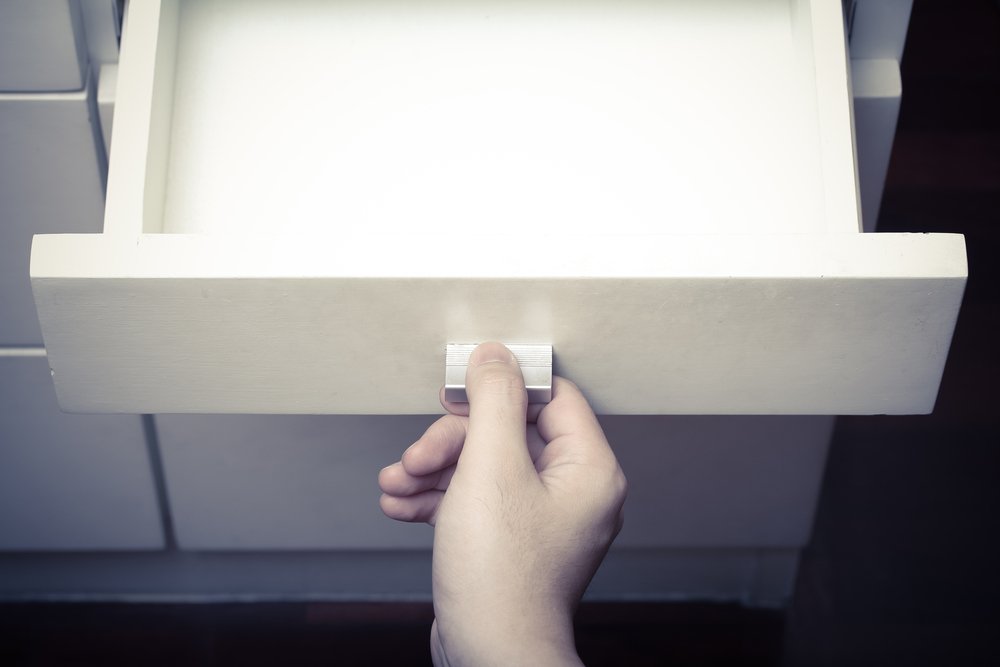 An empty kitchen draw where the knives should be | Shutterstock