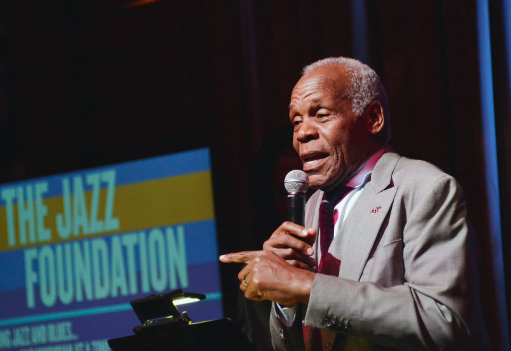 Image Source: Getty Images/Chelsea Guglielmino| Actor Danny Glover speaks onstage as Quincy Jones hosts Jazz Foundation LA Fundraiser honoring Johnny Mathis at Herb Alpert's Vibrato Grill & Jazz on November 4, 2018 in Los Angeles, California Image Source: Getty Images/Chelsea Guglielmino| Actor Danny Glover speaks onstage as Quincy Jones hosts Jazz Foundation LA Fundraiser honoring Johnny Mathis at Herb Alpert's Vibrato Grill & Jazz on November 4, 2018 in Los Angeles, California