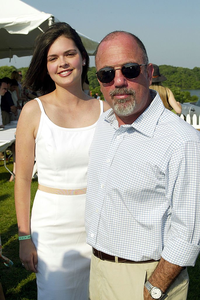 Image Credits: Getty Images / Scott Gries | Musician Billy Joel and his date Kate Lee pose for a photo at the 9th Annual Mercedes-Benz Polo Challenge to benefit The Retreat July 12, 2003 at the Bridgehampton Polo Club in Bridgehampton, New York. Image Credits: Getty Images / Scott Gries | Musician Billy Joel and his date Kate Lee pose for a photo at the 9th Annual Mercedes-Benz Polo Challenge to benefit The Retreat July 12, 2003 at the Bridgehampton Polo Club in Bridgehampton, New York.