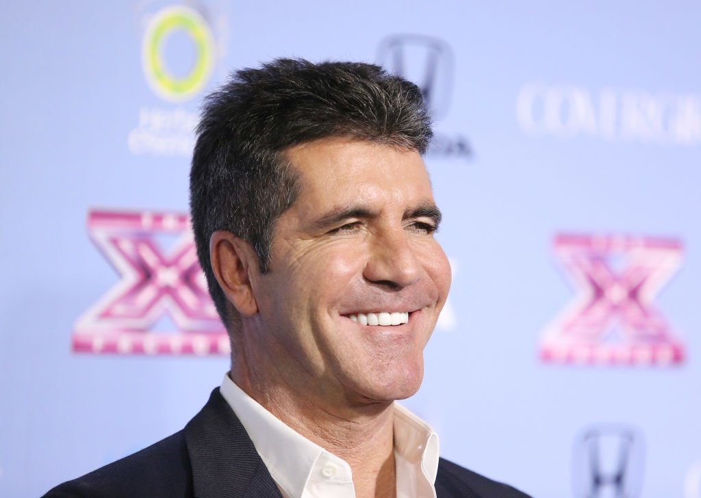 Image Credit: Getty Images / Simon Cowell arrives at "The X Factor" finalists party held at SLS Hotel on November 4, 2013 in Los Angeles, California.