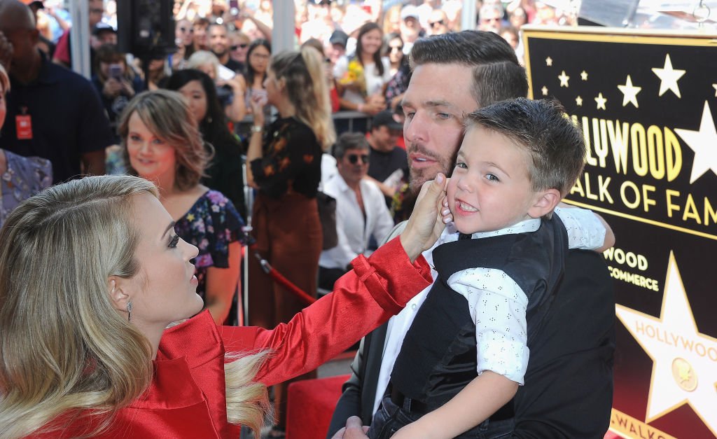 Image Credit: Getty Images / Musician Carrie Underwood, husband Mike Fisher and son Isaiah Michael Fisher at Carrie Underwood Star Ceremony On The Hollywood Walk Of Fame held on September 20, 2018 in Hollywood.