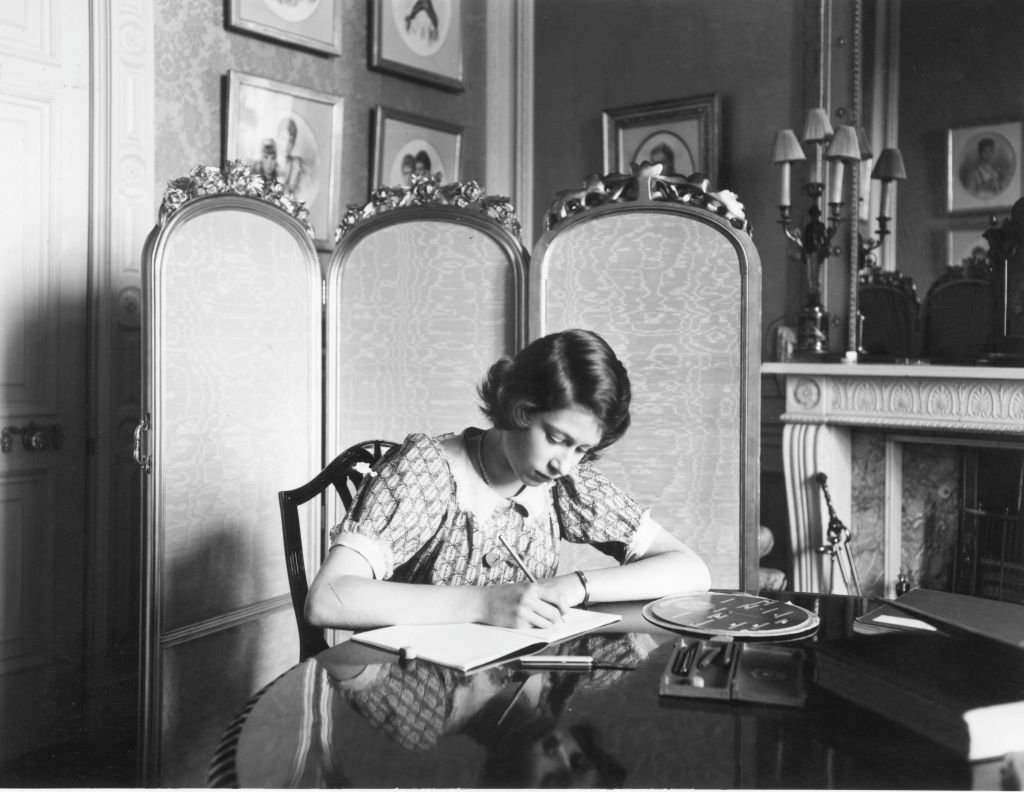 Image Credit: Getty Images / Princess Elizabeth working on her studies at a desk in Windsor Castle on 22nd June 1940.