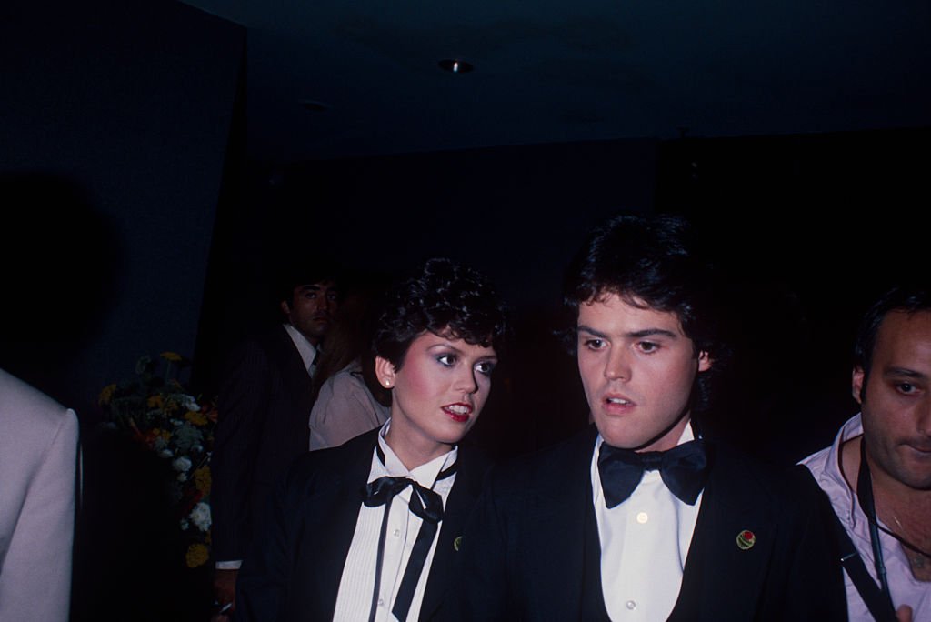 Image Credit: Getty Images / Donny Osmond talking to his sister Marie Osmond at a formal event; circa 1970; New York.