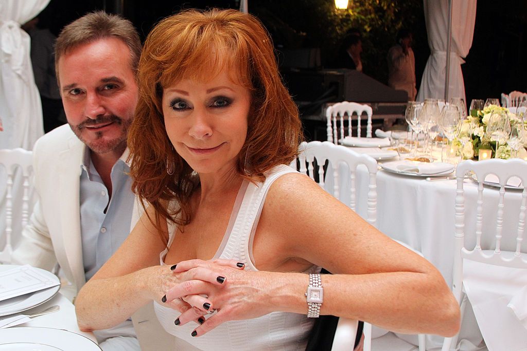 Reba McEntire, Brandon's ex-stepmother introduced Kelly and Blake / Getty Images