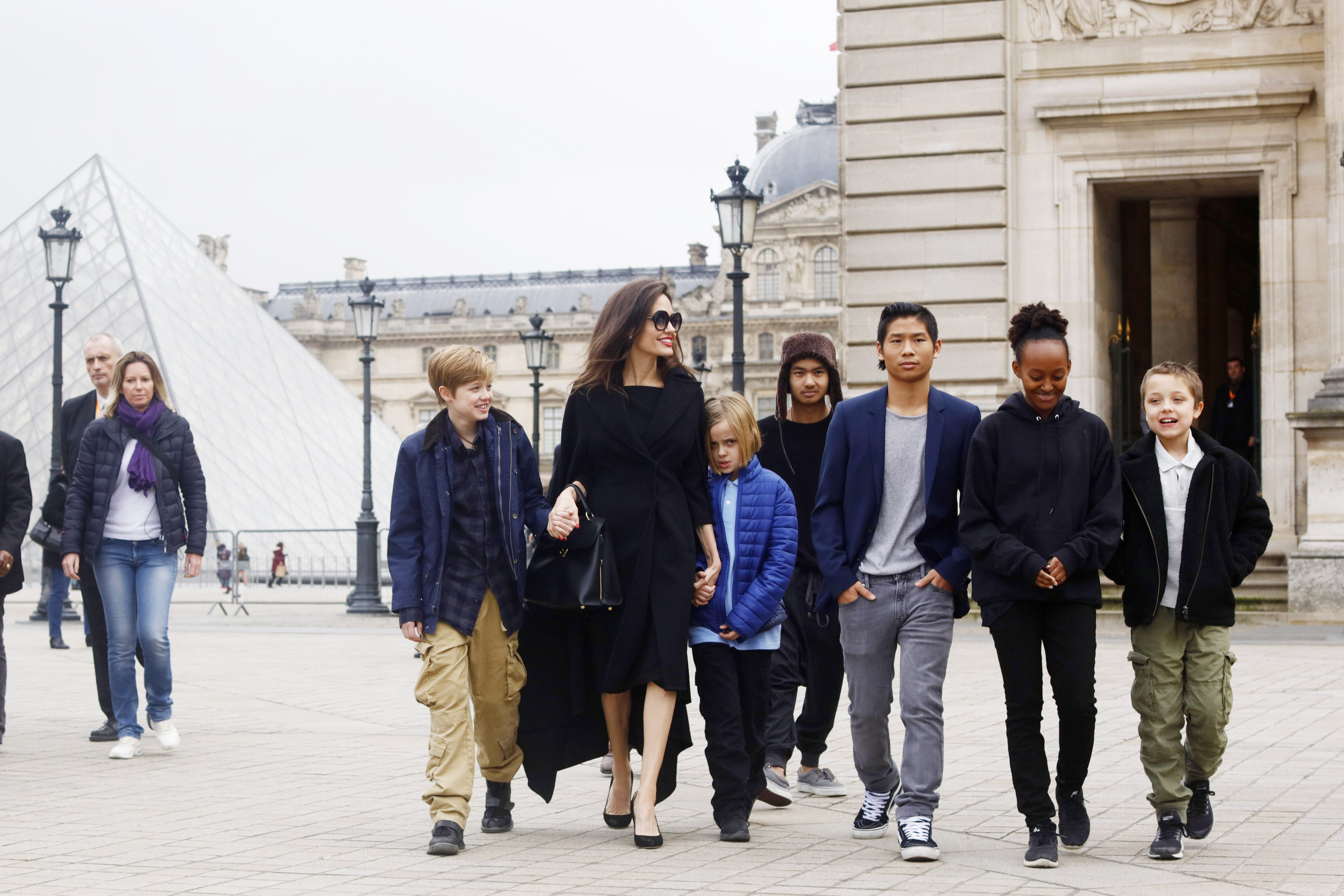 Image Credit: Getty Images/NurPhoto via Getty Images/Mehdi Taamallah | Angelina with all her children in Paris