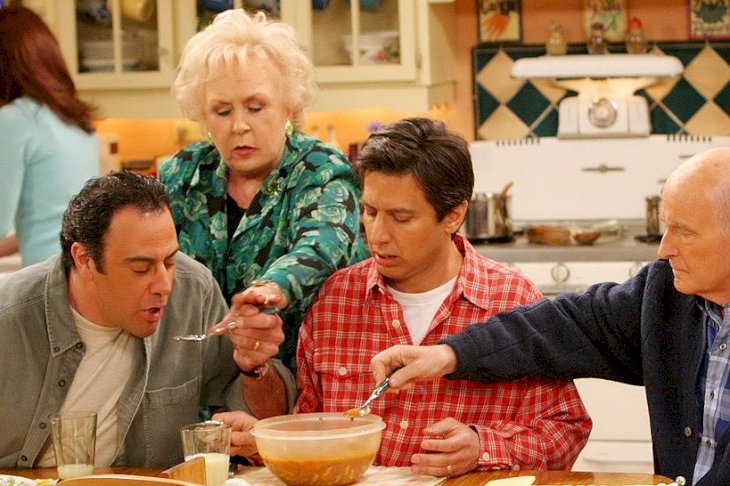 Image Credits: Getty Images / EVERYBODY LOVES RAYMOND. From left to right: Brad Garrett, Doris Roberts, Ray Romano, Peter Boyle. Patricia Heaton featured in background.
