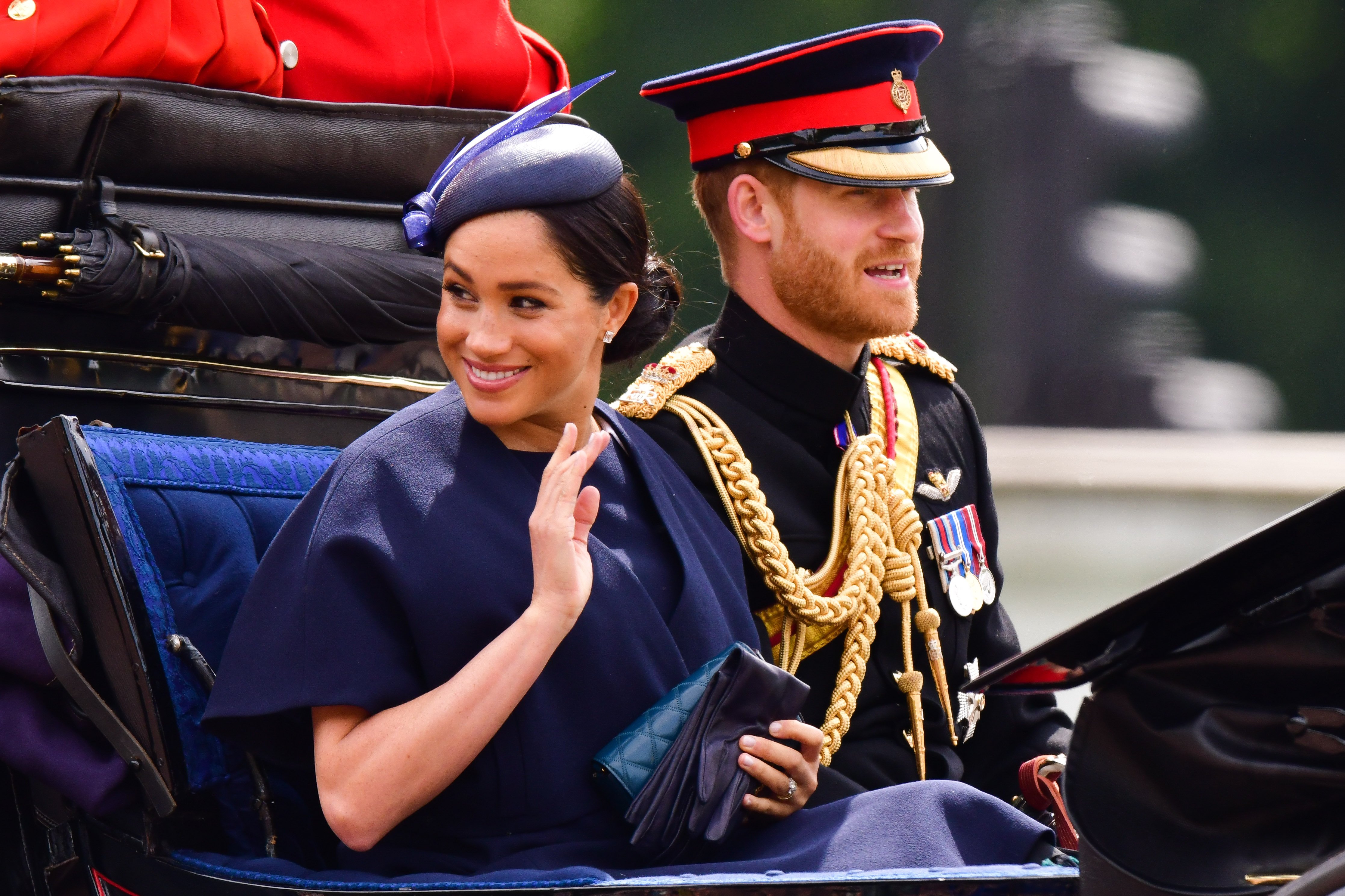 Image Credits: Getty Images / James Devaney | Meghan, Duchess of Sussex and Prince Harry, Duke of Sussex leave Buckingham Palace in a carriage during Trooping The Colour, the Queen's annual birthday parade, on June 8, 2019 in London, England.