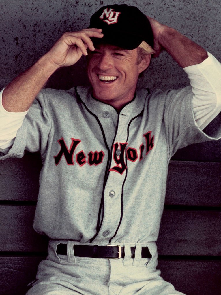 Image Credits: Getty Images / Juergen Vollmer / Popperfoto | American actor Robert Redford stars as baseball player Roy Hobbs in the film 'The Natural', 1983.