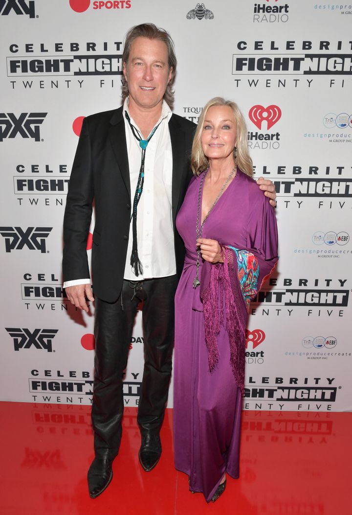 Image Credits: Getty Images / / The model and Hollywood actor Bo Derek and John Corbett are photographed by the press.