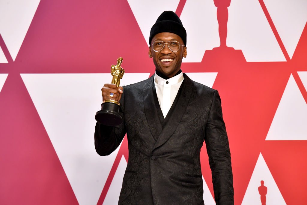 Image Credits: Getty Images / Jeff Kravitz/FilmMagic | Mahershala Ali poses with the Best Supporting Actor award for Green Book" in the press room