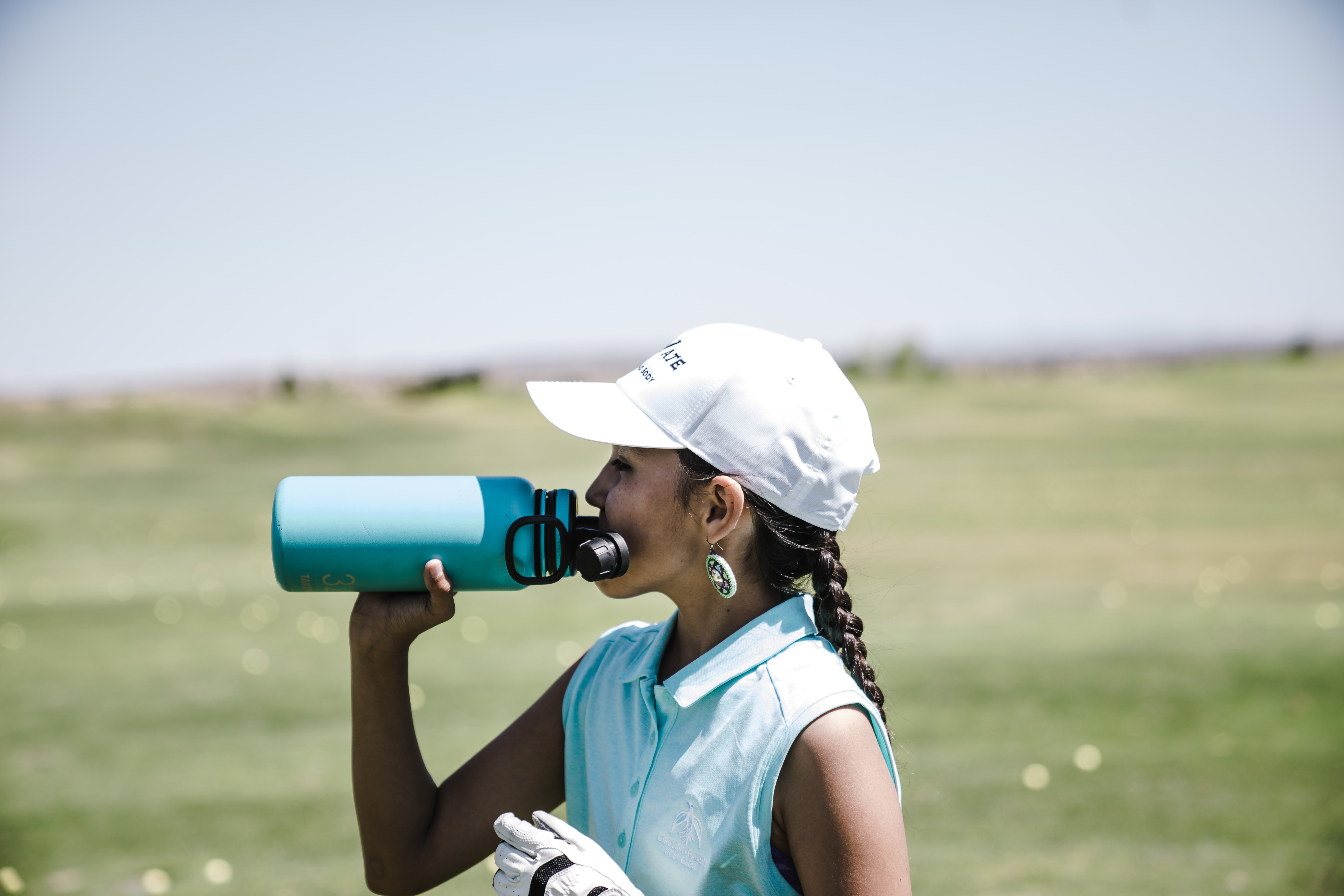 Woman drinking water | Pexels