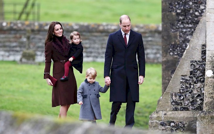 Image Credit: Getty Images / Catherine, Duchess of Cambridge and Prince William, Duke of Cambridge, Prince George of Cambridge and Princess Charlotte of Cambridge arrive to attend the service at St Mark's Church on Christmas Day.