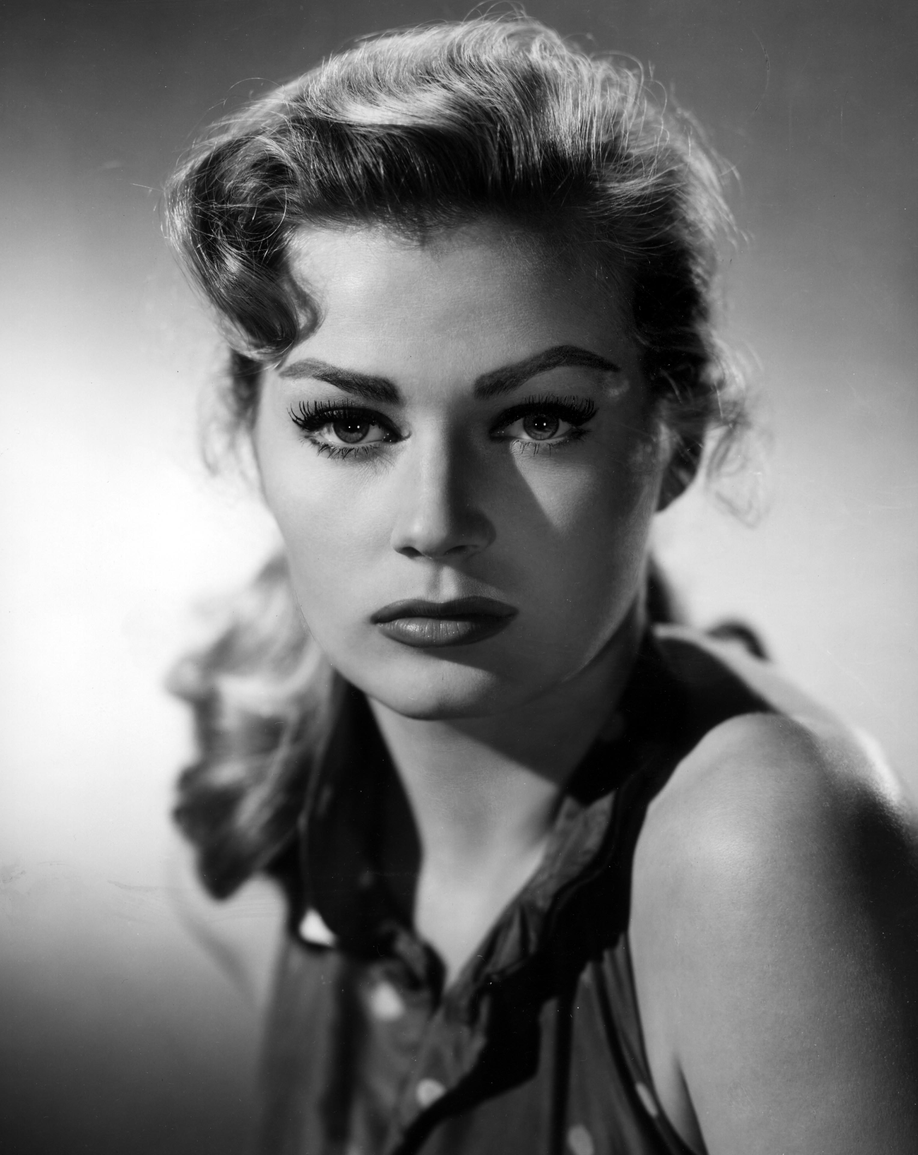 Image Source: Getty Images| Anit's signature look in a black and white photograph Image Source: Getty Images| Anit's signature look in a black and white photograph