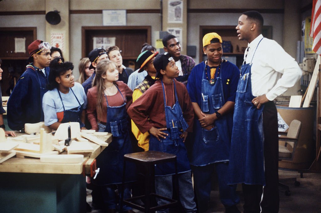 Image Credits: Getty Images / Walt Disney Television | Mark Curry (as Mr. Cooper) stars in the T.V series "Hanging with Mr. Cooper." A single high school teacher and basketball coach living in Oakland, California. Omar Gooding (second from right) co-stars as Earvin Rodman. Image Credits: Getty Images / Walt Disney Television | Mark Curry (as Mr. Cooper) stars in the T.V series "Hanging with Mr. Cooper." A single high school teacher and basketball coach living in Oakland, California. Omar Gooding (second from right) co-stars as Earvin Rodman.