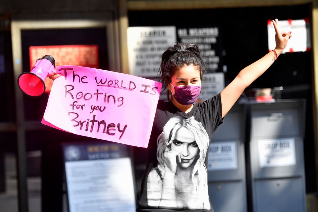Image Credit: Getty Images / A supporter of Britney Spears gathers with others outside a courthouse in downtown for a #FreeBritney protest as a hearing regarding Spears' conservatorship is in session on July 22, 2020. Image Credit: Getty Images / A supporter of Britney Spears gathers with others outside a courthouse in downtown for a #FreeBritney protest as a hearing regarding Spears' conservatorship is in session on July 22, 2020.