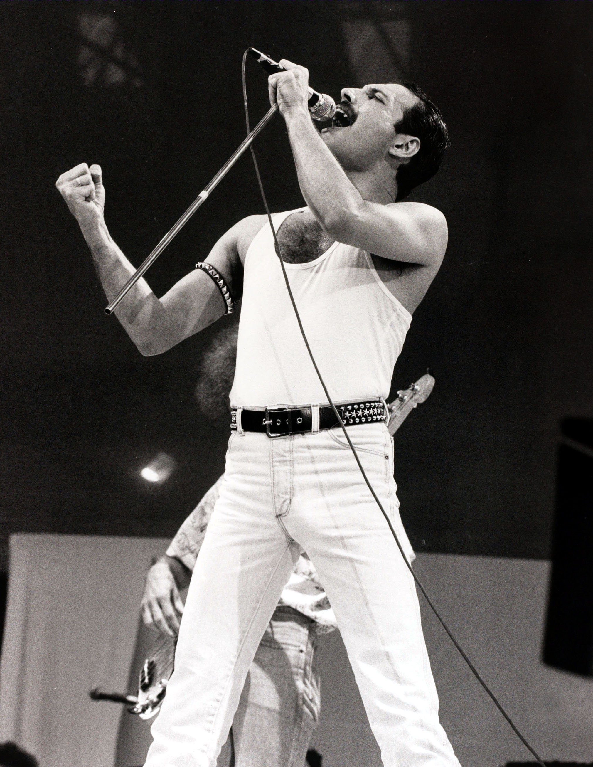 Image Credit: Getty Images/Popperfoto via Getty Images | Mercury signing at Live Aid Concert in 1985