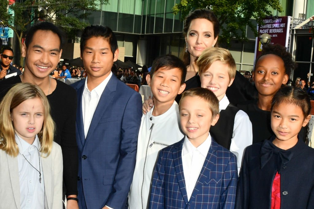 Image Credits: Getty Images / George Pimentel / WireImage | Vivienne Jolie-Pitt, Maddox Jolie-Pitt, Pax Jolie-Pitt, Kimhak Mun, Knox Jolie-Pitt, Shiloh Jolie-Pitt, Angelina Jolie, Zahara Jolie-Pitt and Sareum Srey Moch attend 2017 Toronto International Film Festival - "First They Killed My Father" Premiere at Princess of Wales Theatre on September 11, 2017 in Toronto, Canada.