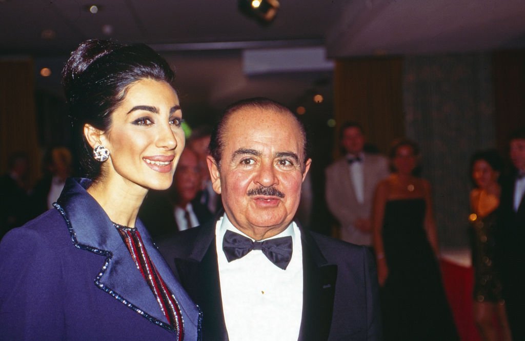 Image Credit: Getty Images /Adnan Khashoggi with wife Soraya at UNESCO Gala in Neuss, Germany, 1996.